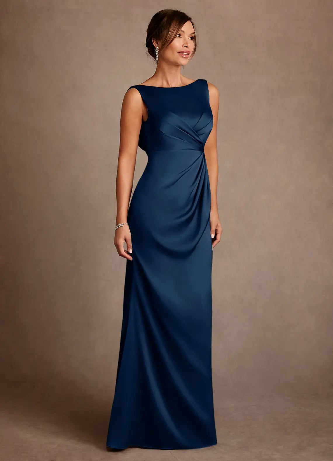 Elegant navy satin mother of the bride dress with a trumpet silhouette, bateau neckline, sleeveless design, and graceful cowl back. Ideal for formal weddings and galas.